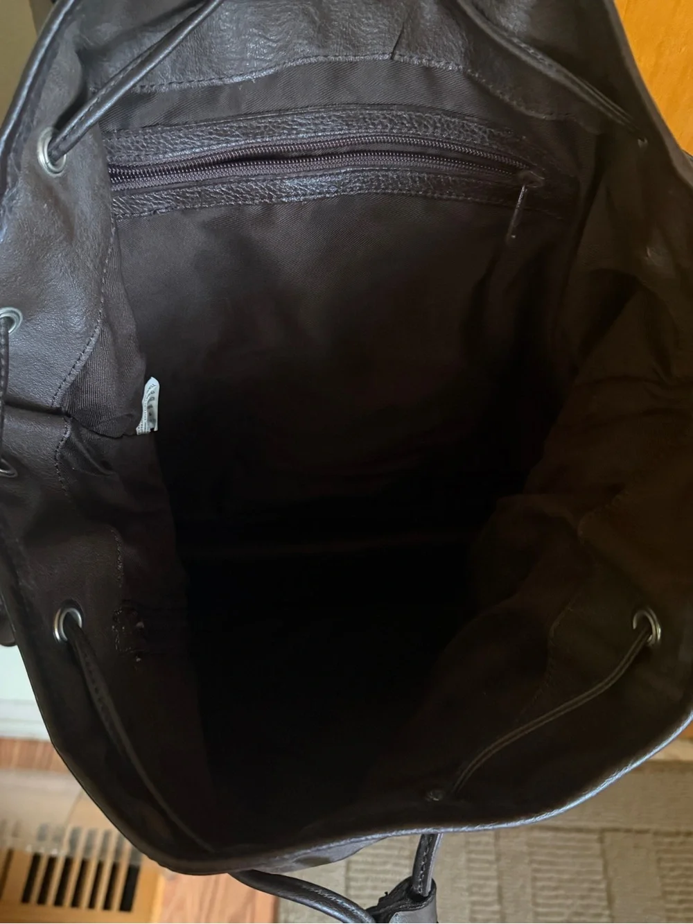 Dark Brown Leather Drawstring Backpack with Silver Hardware